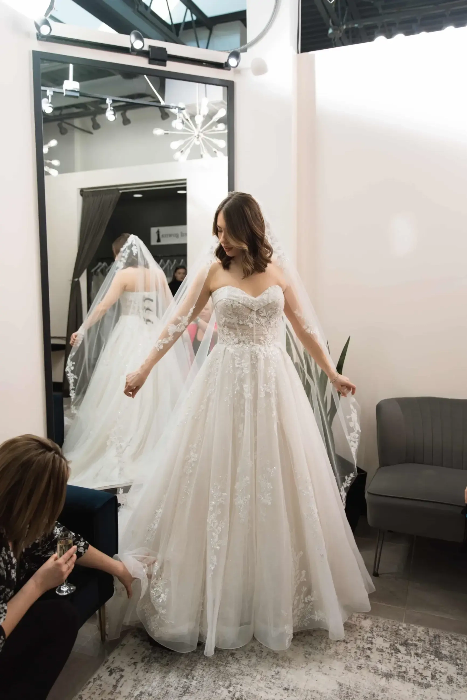 bride tries on wedding gowns