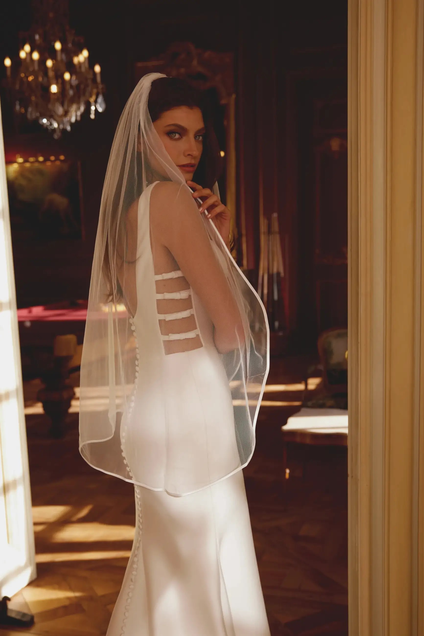 Model is wearing a mikado justin alexander bridal gown