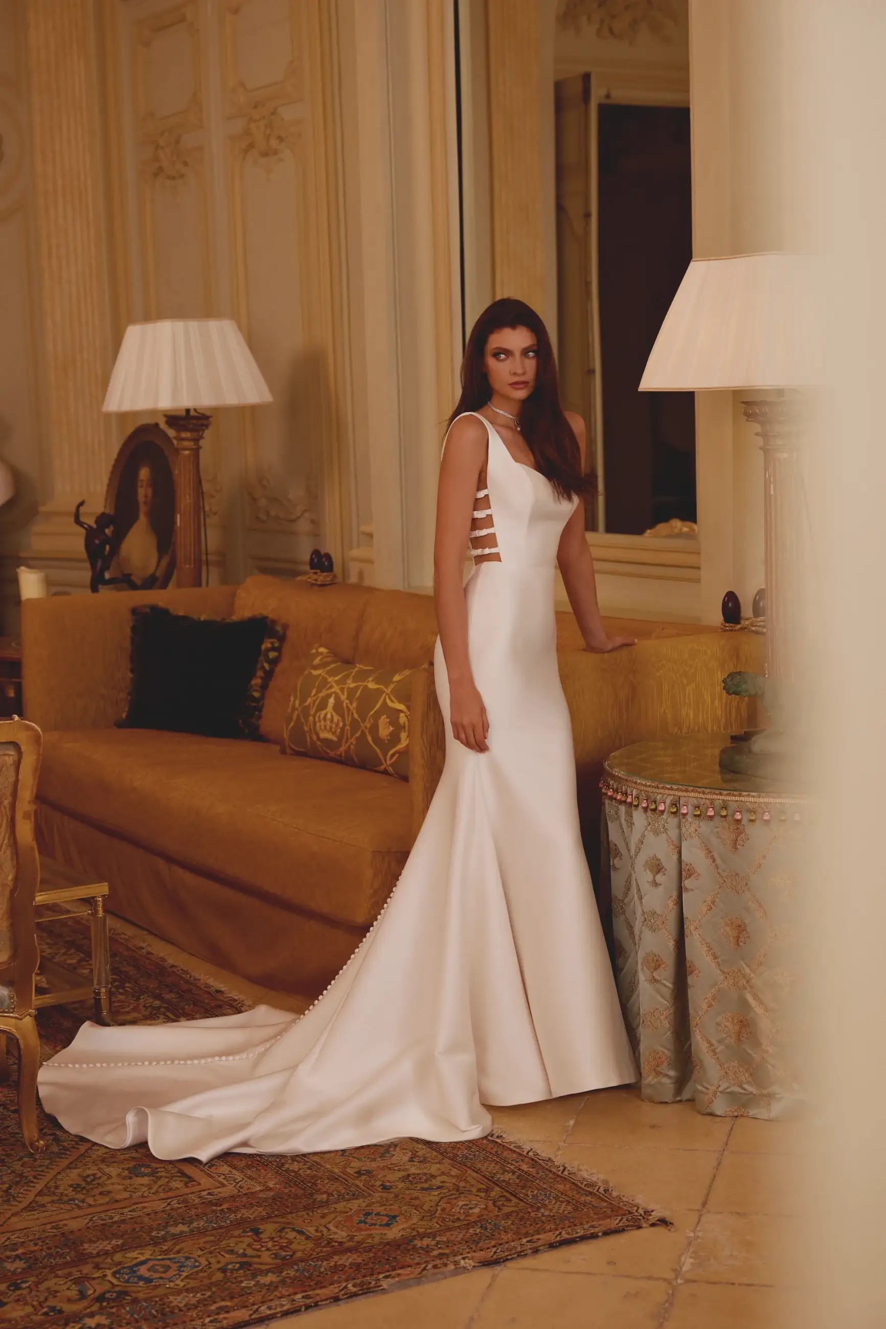 Model is wearing a mikado justin alexander bridal gown