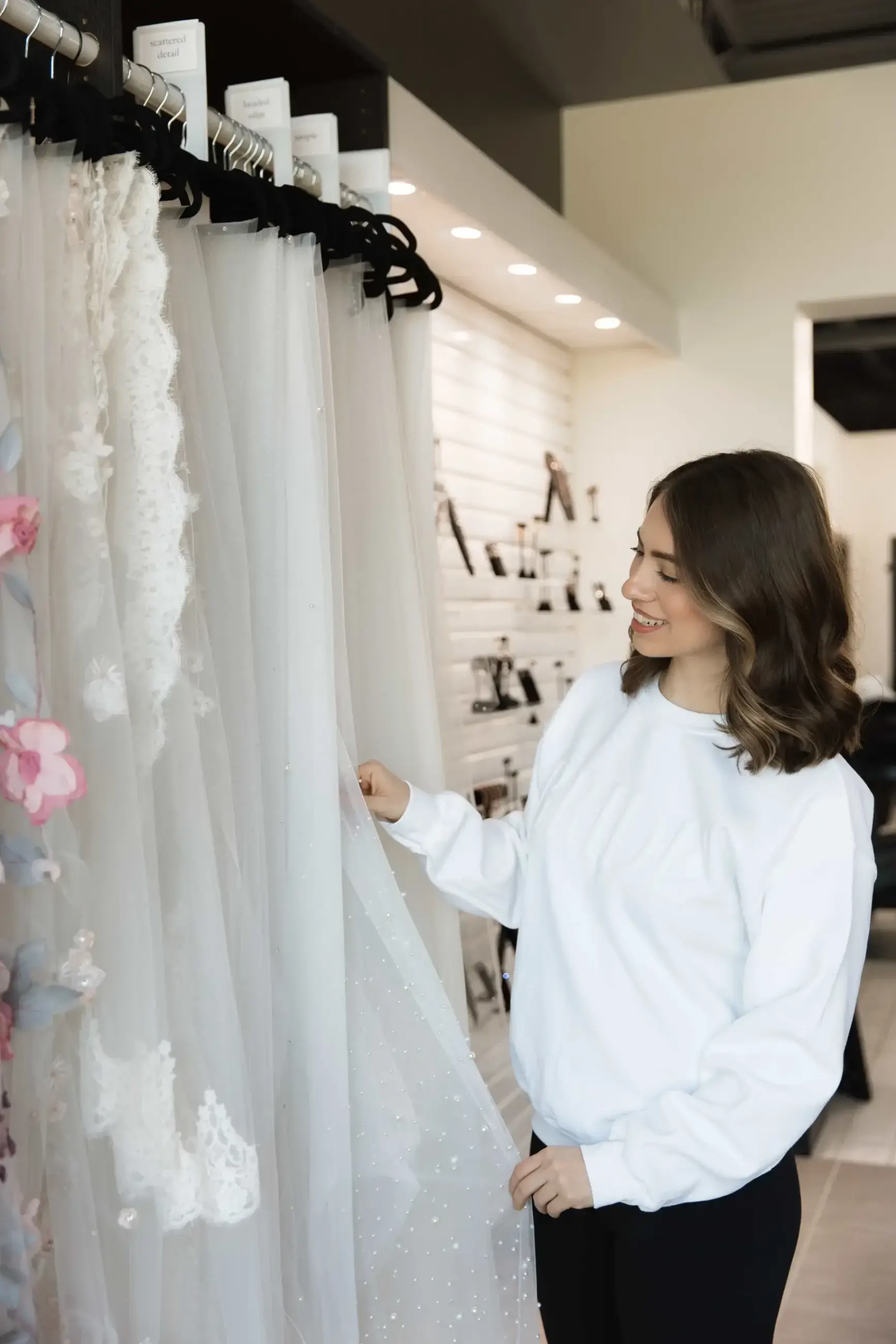 bride tries on wedding dresses