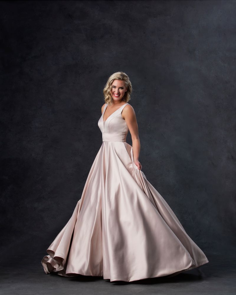 Bride wearing blush colored ballgown wedding dress