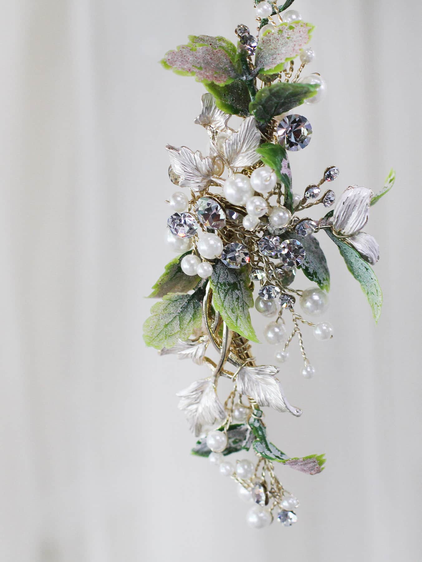 Bride's hair piece with leaves, pearls, and diamonds