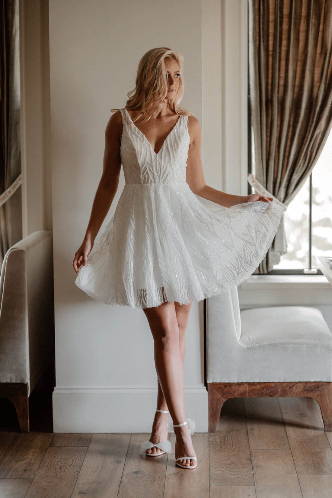 Woman wearing a white sparkly short dress