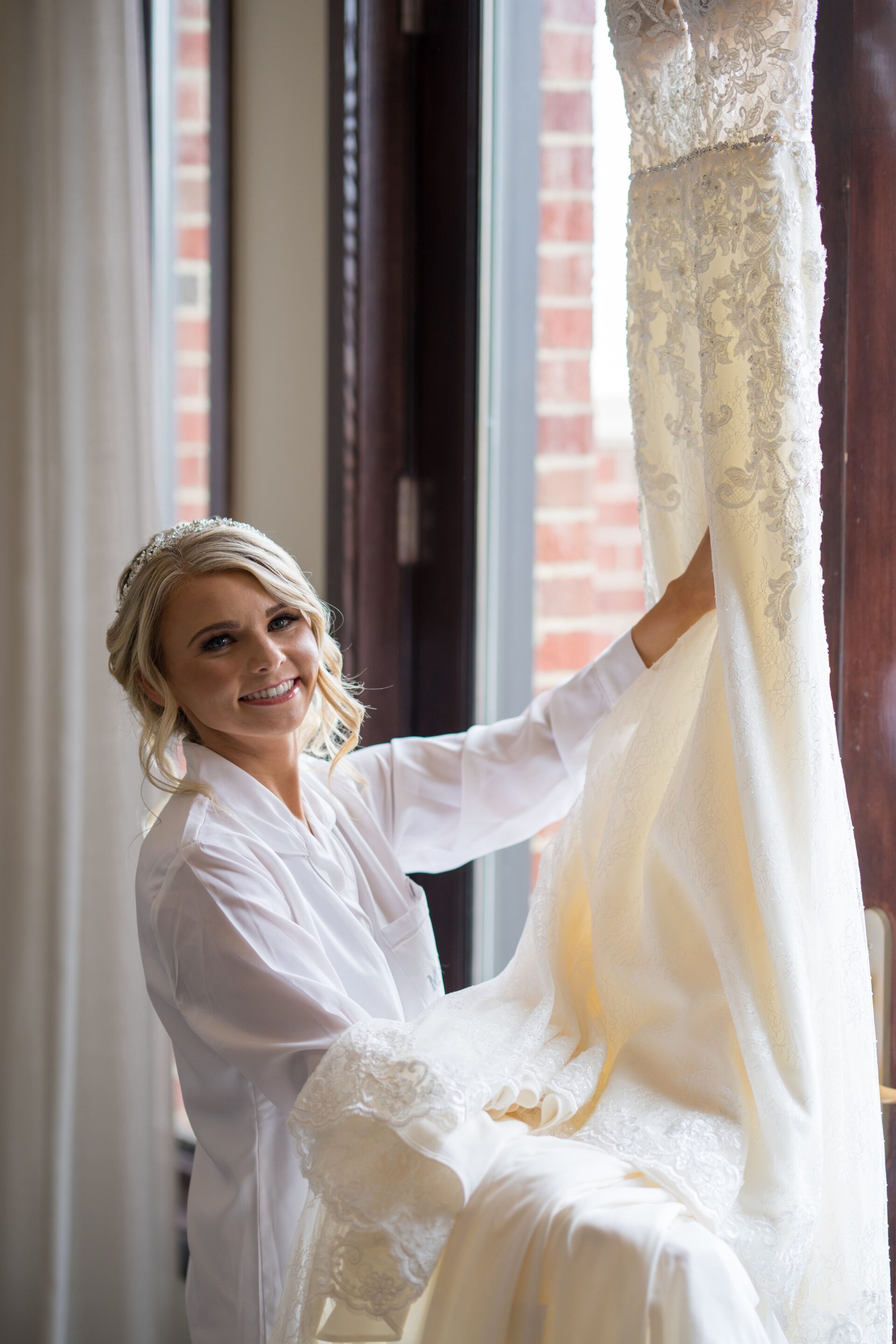 Caucasian woman wearing Maggie Sottero mini strapless wedding dress